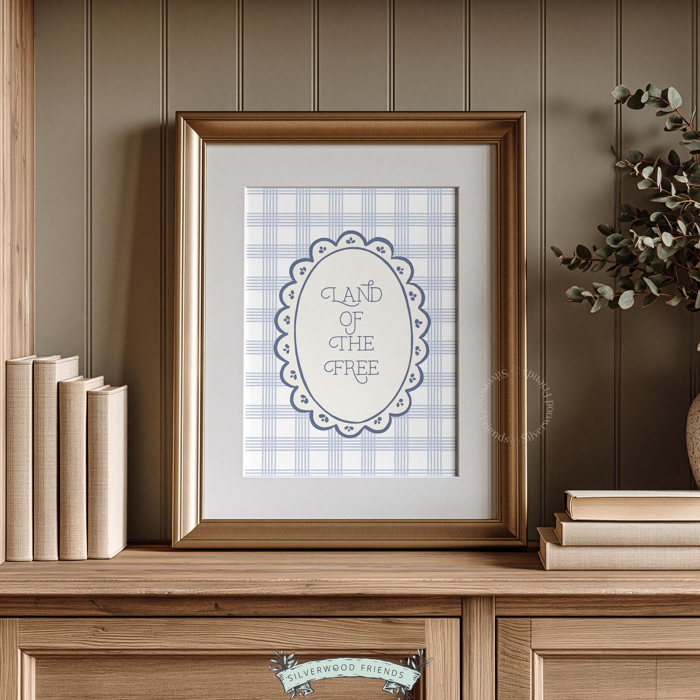 Americana typography picture for living room — soft vintage oval frame with muted plaid backdrop