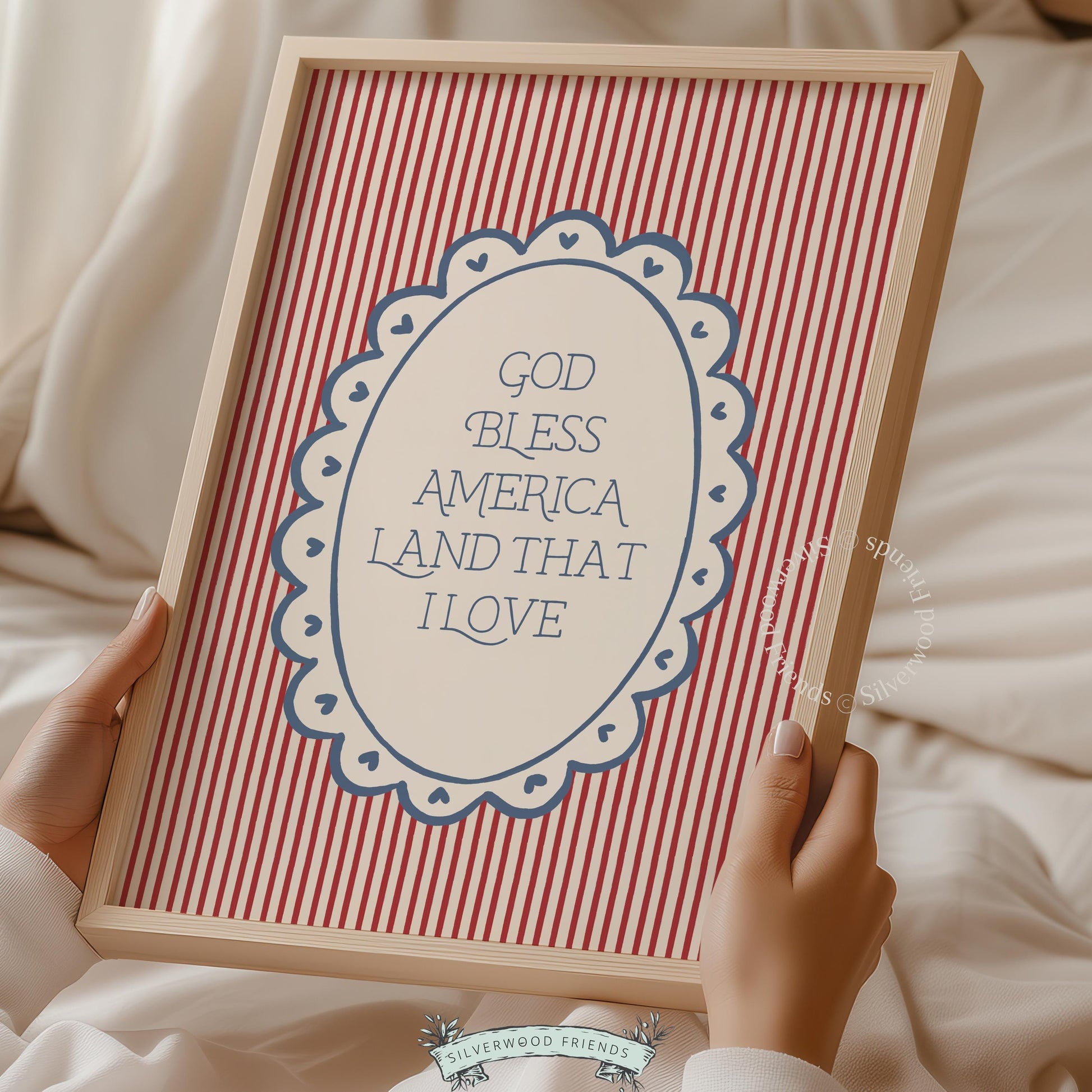 Home of the Brave wall picture featuring vintage lettering — blue bordered oval on red and white striped farmhouse background