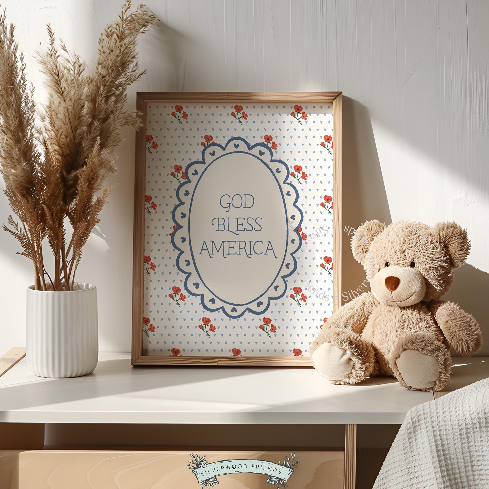 Vintage-inspired patriotic wall picture with navy typography and scattered cherry bouquets on light blue background