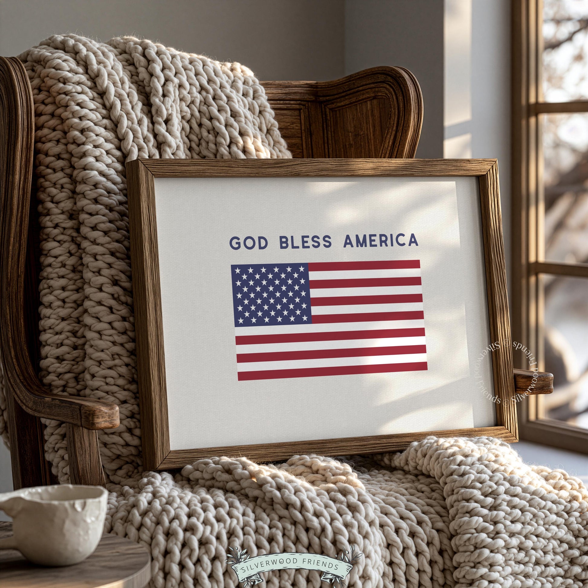 Americana artwork featuring centered red, white, blue flag with patriotic phrase modern minimalist style