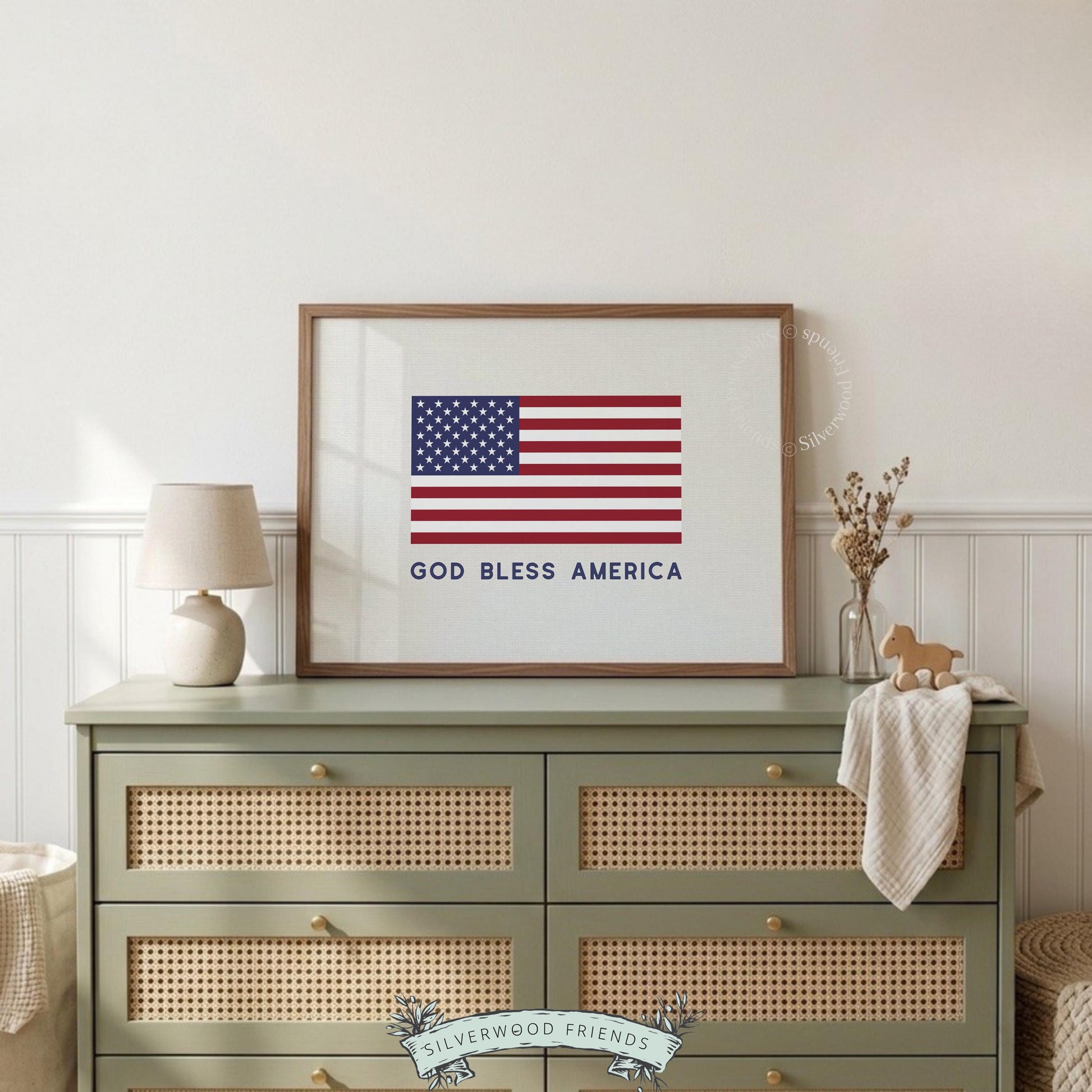 American flag poster with "God Bless America" text — bold red, white, blue patriotic design on cream background