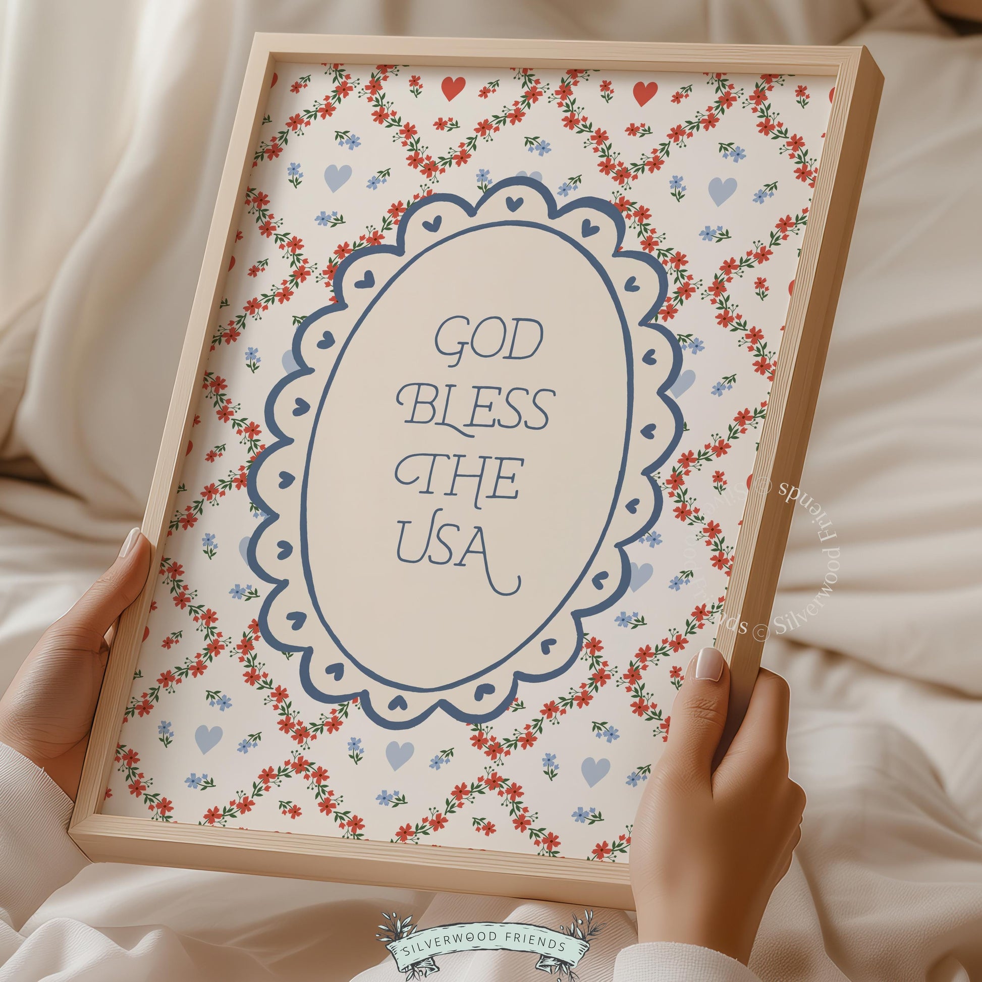 Holiday and seasonal poster art featuring patriotic blessing — scalloped oval typography with folksy heart and vine design