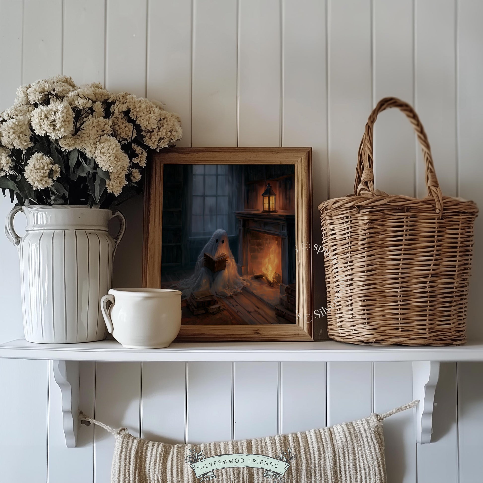Cute ghost reading book printable art for bedroom — cozy fireplace scene with moody Halloween aesthetic
