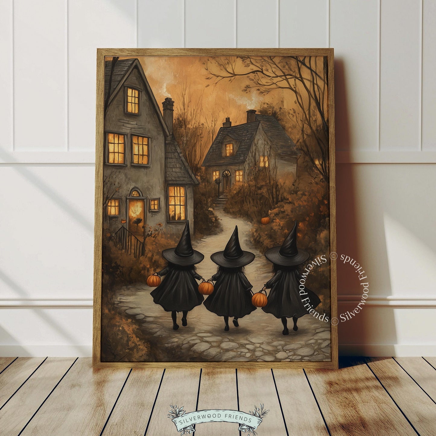Charming trick-or-treat printable art for Halloween displays — warm amber-lit pathway through cottagecore village