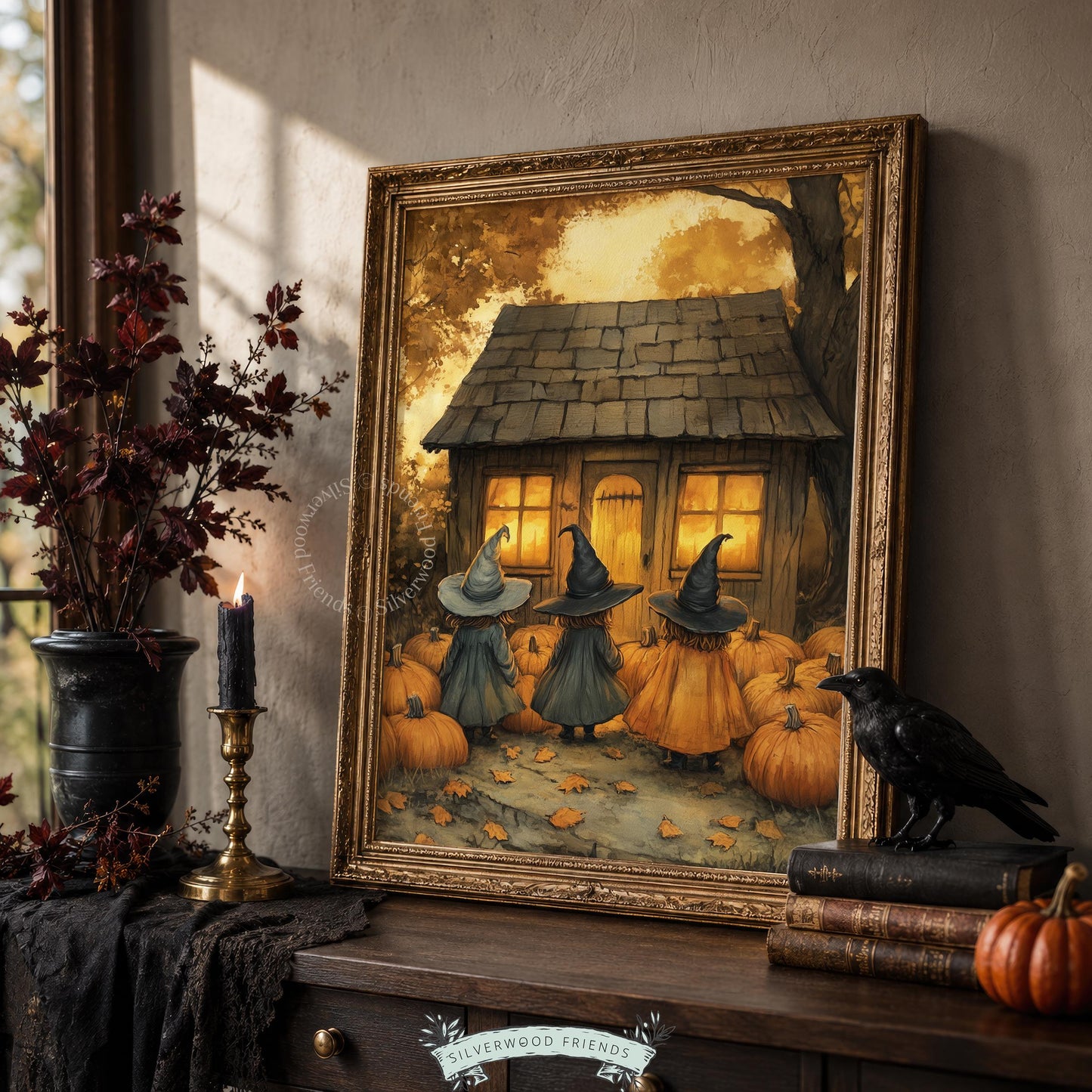 Seasonal Halloween digital print for kitchen — three dark-cloaked sorceresses with pumpkin-filled cottage backdrop