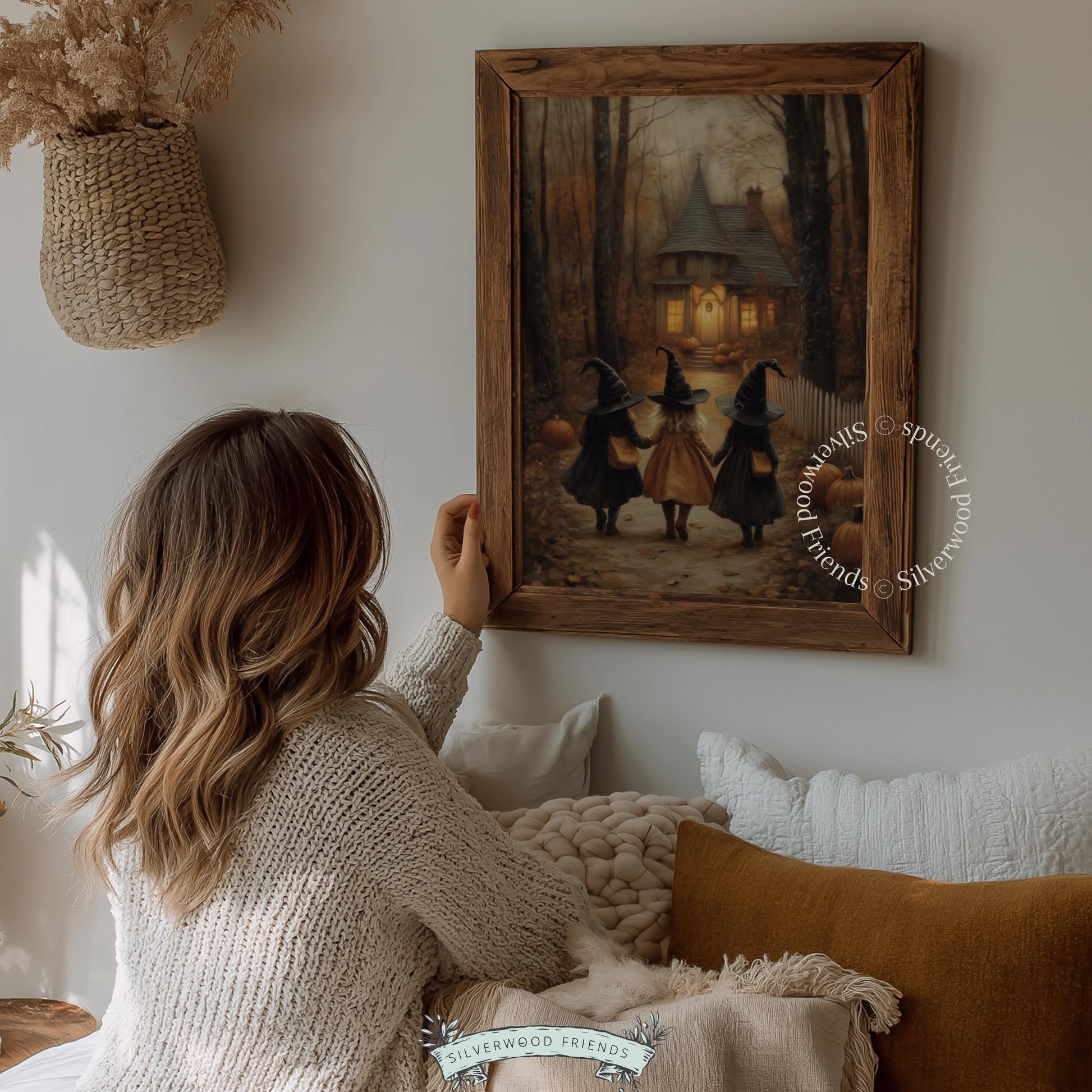 Hand-in-hand witches painting for nursery — spooky-cute storybook scene with pumpkins and glowing cabin