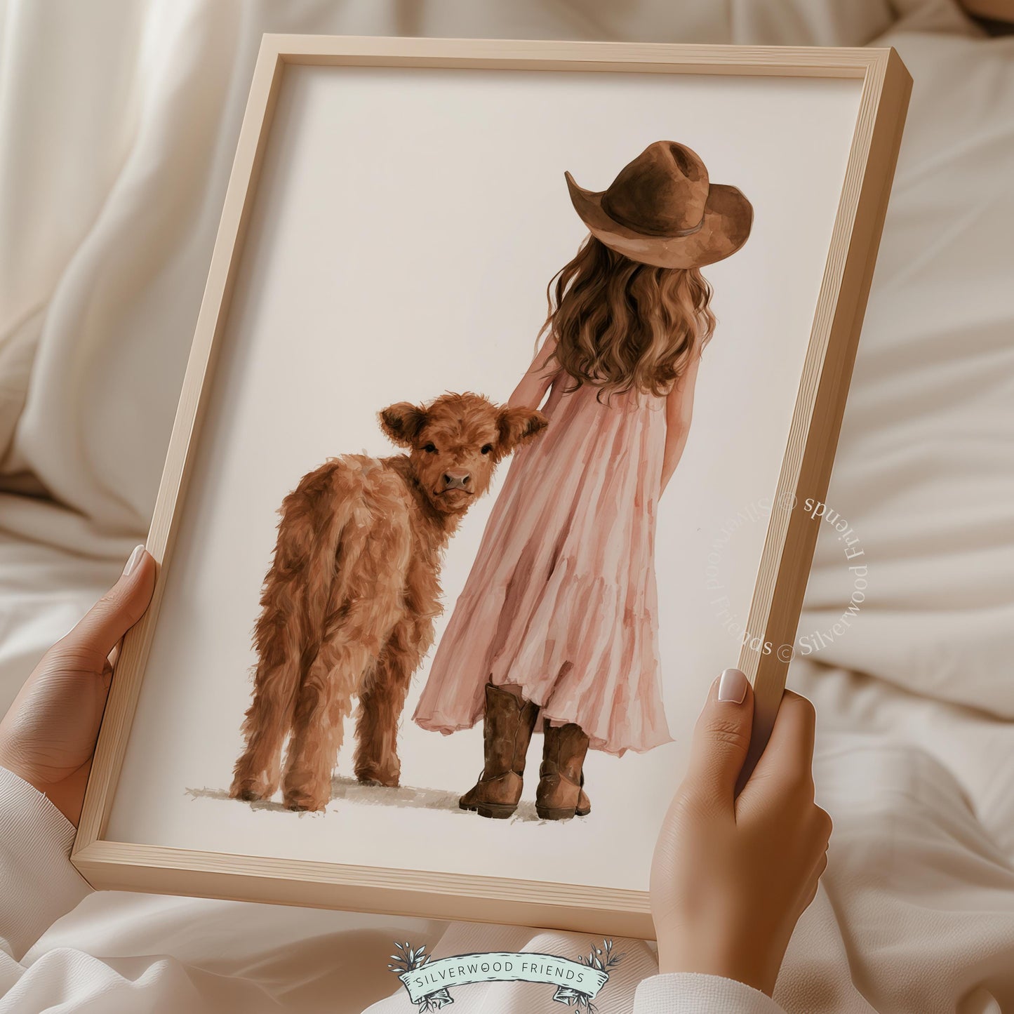 Little girl in pink dress beside fluffy calf wall art for kids room — cozy western nursery décor with neutral palette