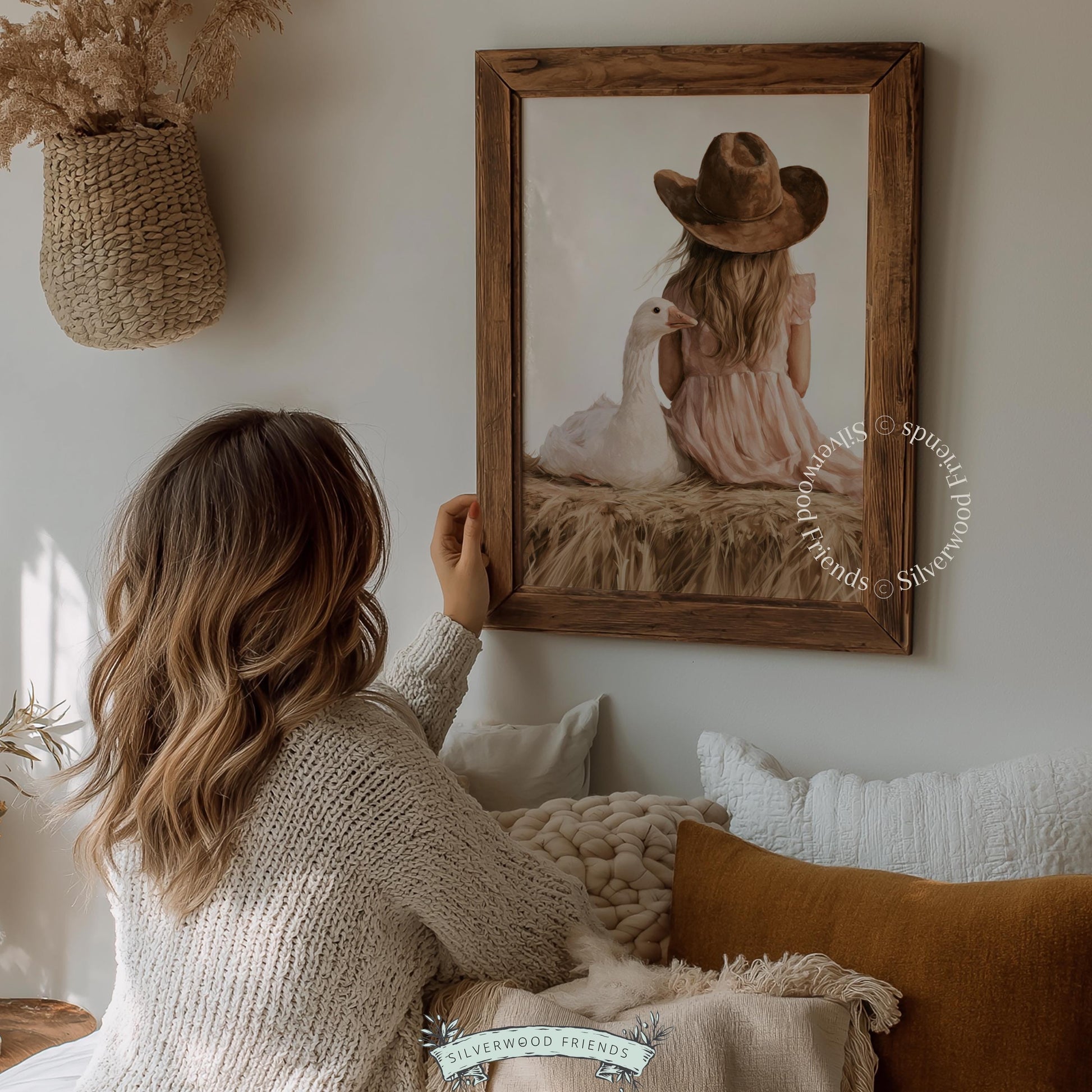 Child sitting with farm animal wall art for playroom — soft-hued watercolor with cottagecore nursery appeal