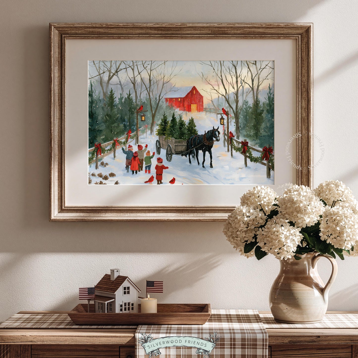 Winter farm landscape wall art featuring festive wagon loaded with evergreens and children in cozy countryside setting