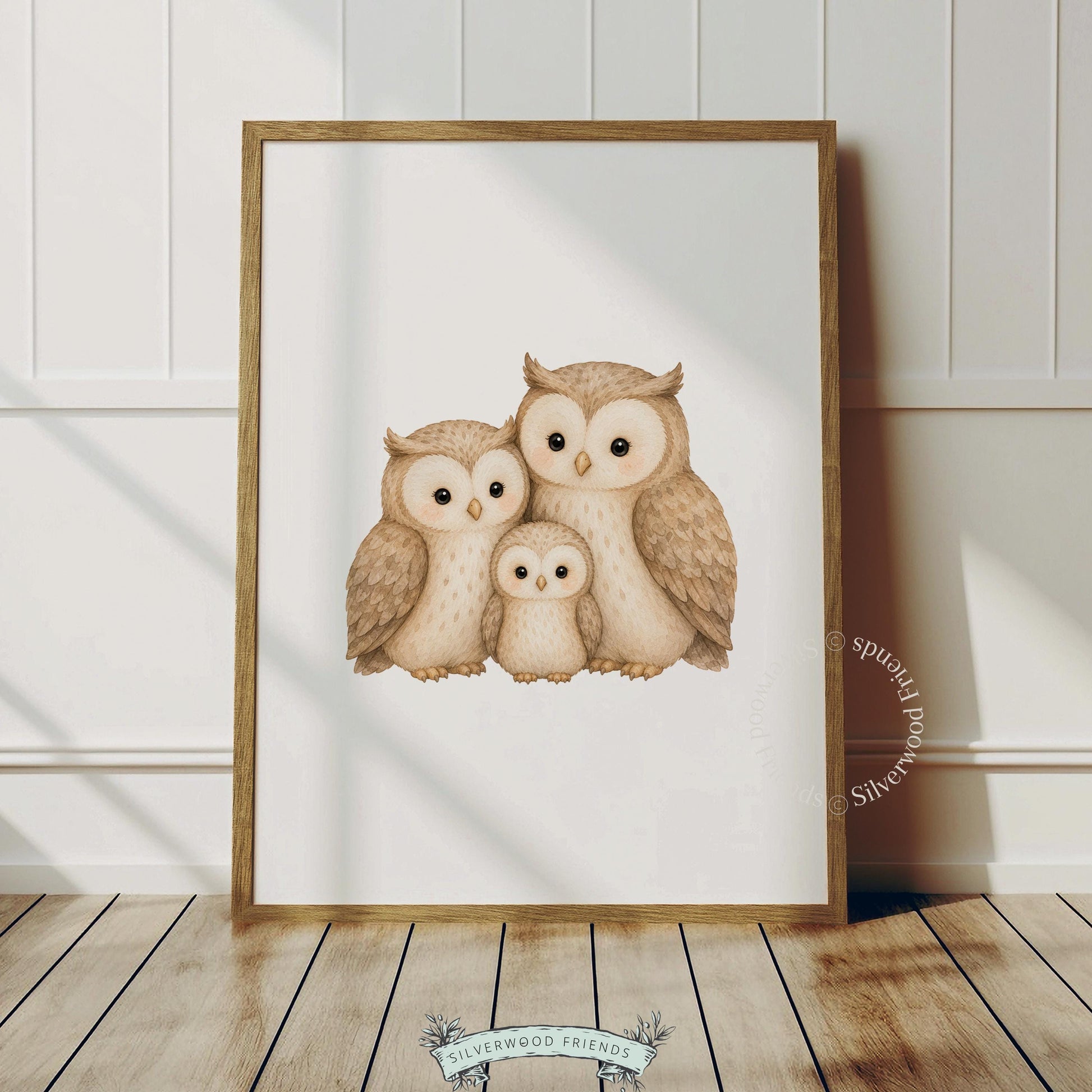 Baby nursery wall print featuring owl family — watercolor illustration of parent birds with tiny owlet in front