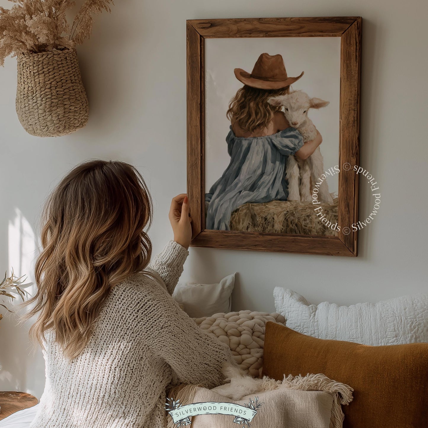 Child holding lamb wall print for rustic nursery — peaceful hayfield portrait with muted earth tones