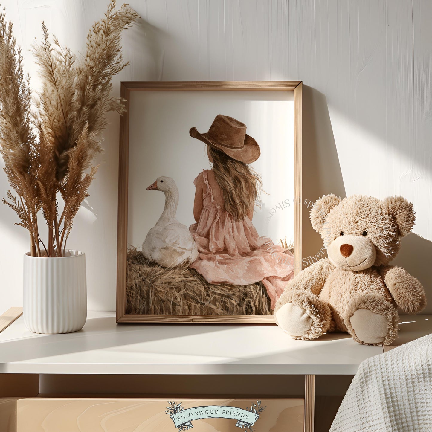 Child on straw with goose artwork for baby nursery — dreamy western farmhouse vibe