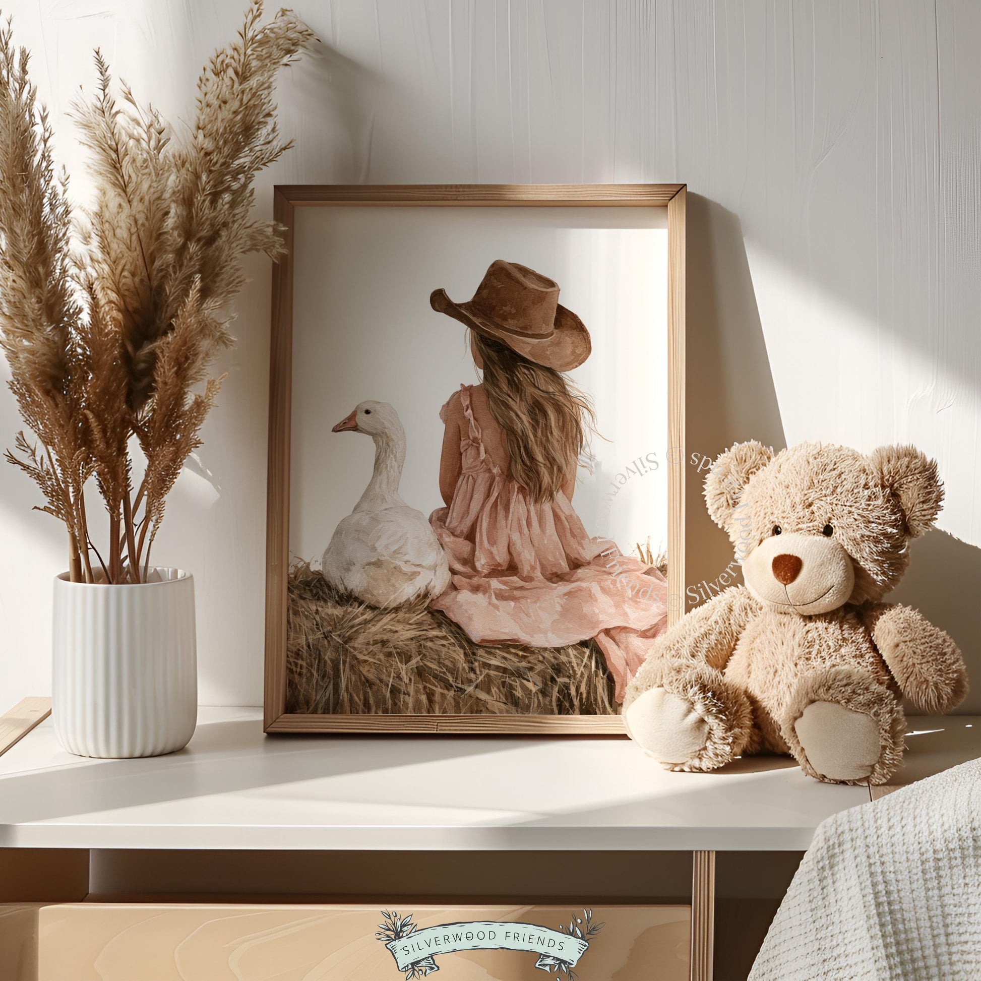 Child on straw with goose artwork for baby nursery — dreamy western farmhouse vibe