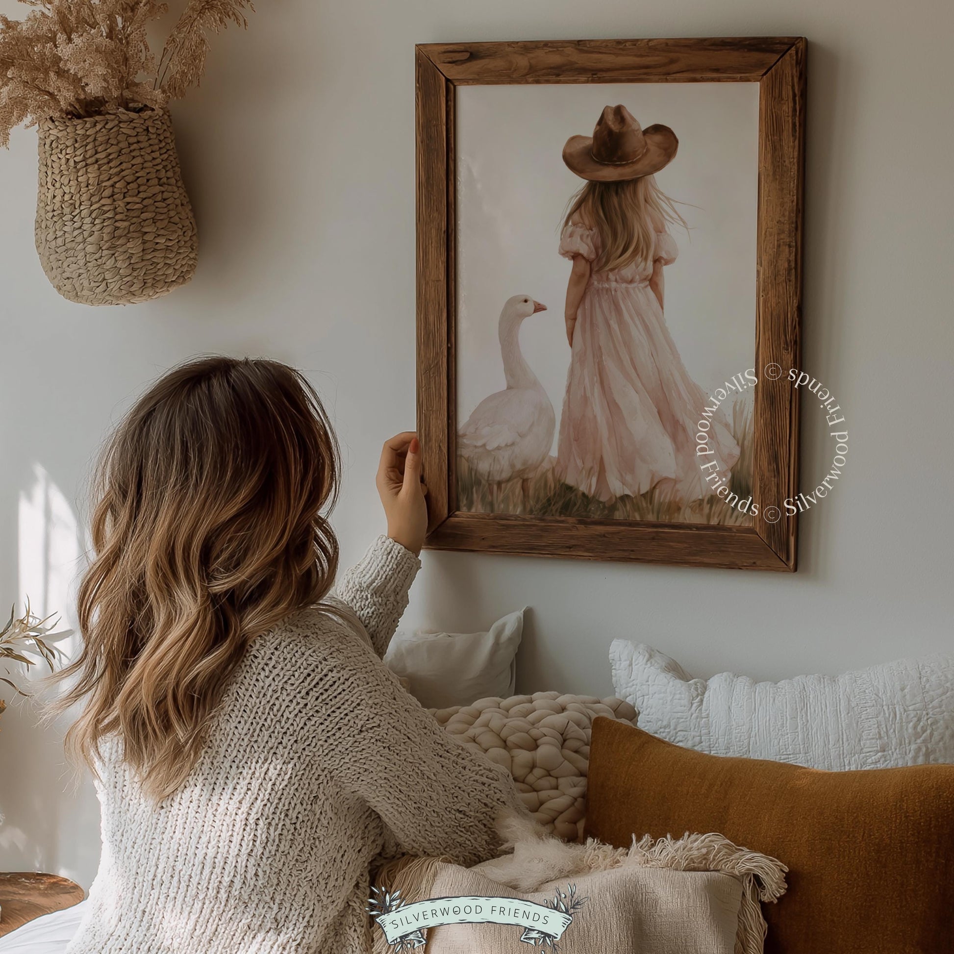 Child with white goose wall decor for toddler room — cream, dusty rose, and wheat color palette