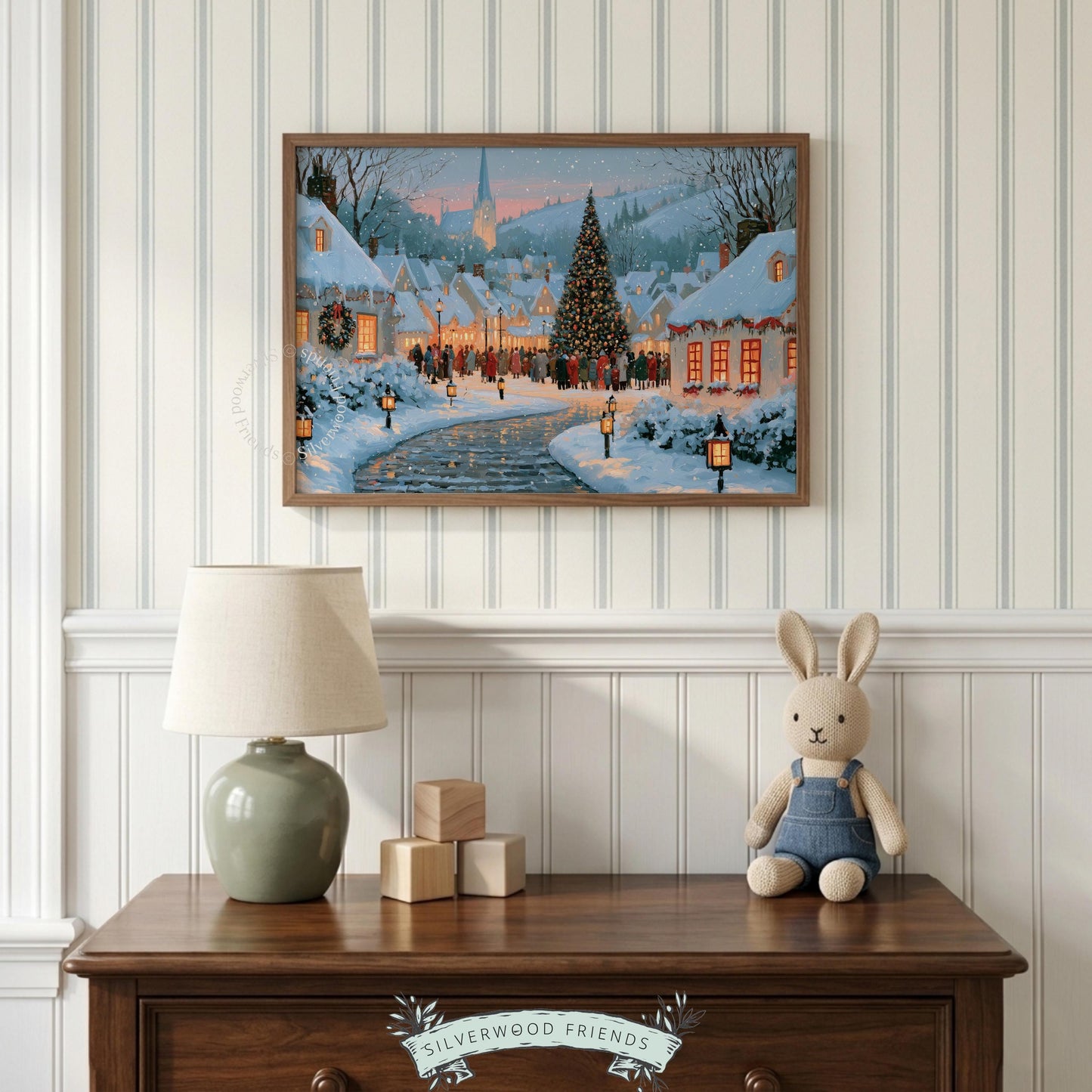 Holiday village landscape wall art for den — cozy nighttime scene with carolers and illuminated architectural details