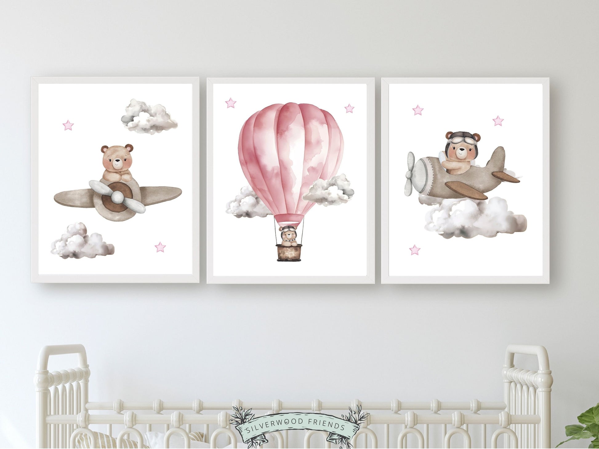 Let their imagination soar with our Pink Hot Air Balloon Nursery Print Set of 3 featuring watercolour teddy bears souring through the sky in a pink hot air balloon and beige airplanes.
