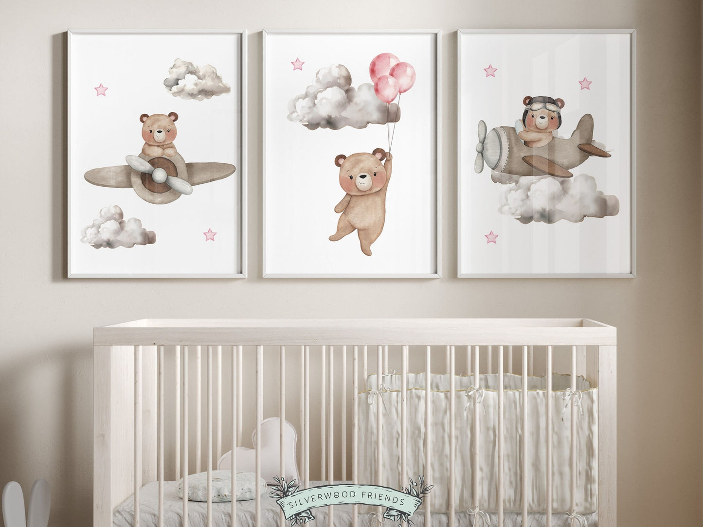 Set of 3 Watercolor Hot Air Balloon Nursery Prints featuring watercolor teddy bears souring through the sky with balloons and airplanes in a neutral pale pink and beige color scheme.Perfect for your girls nursery decor and as an baby shower gift.