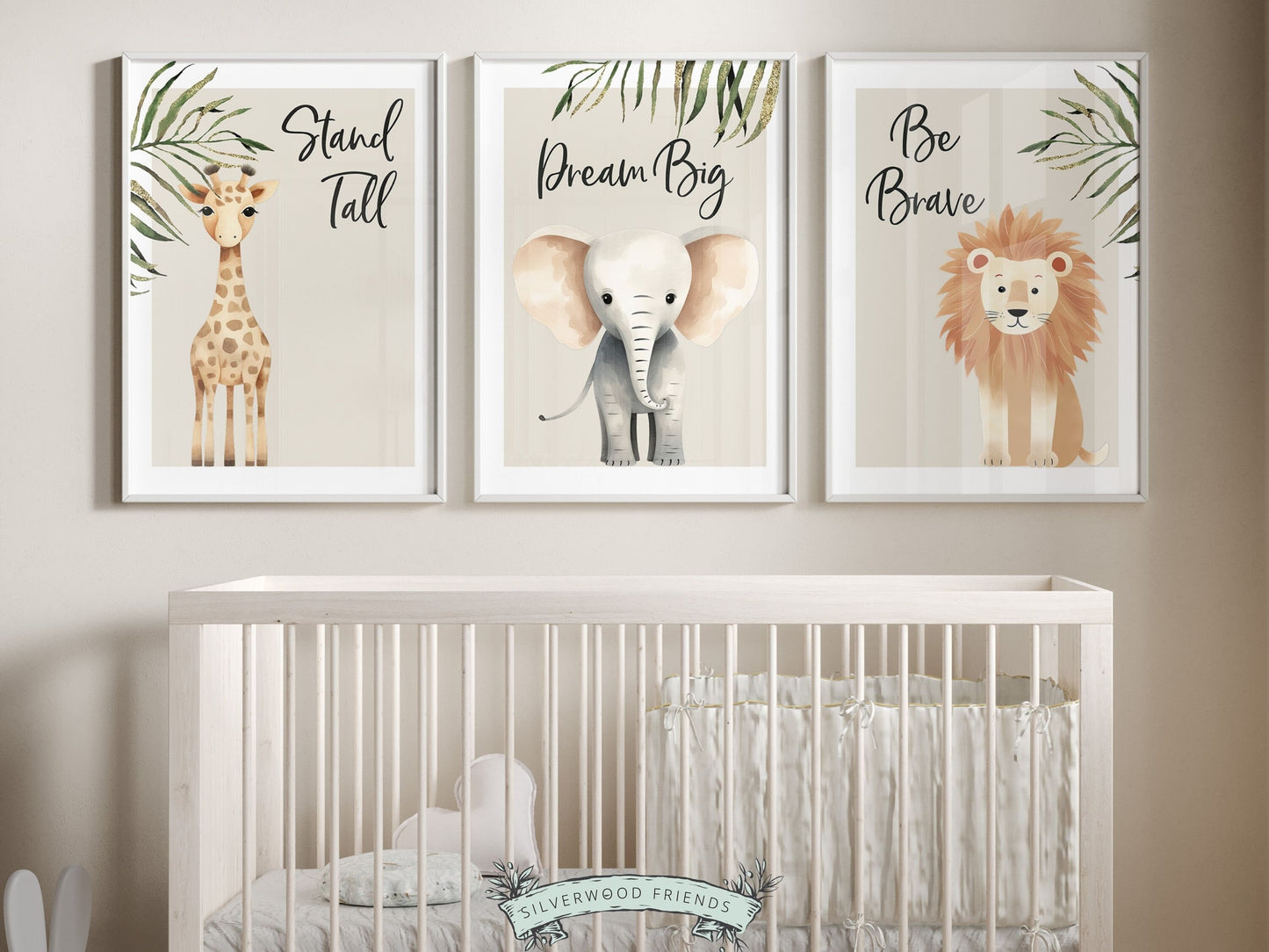 Our Safari Jungle Animal Nursery Prints featuring adorable watercolor illustrations of a giraffe, elephant and lion with jungle leaves and inspirational quotes stand tall, dream big, be brave, is the perfect addition for your safari nursery decor.