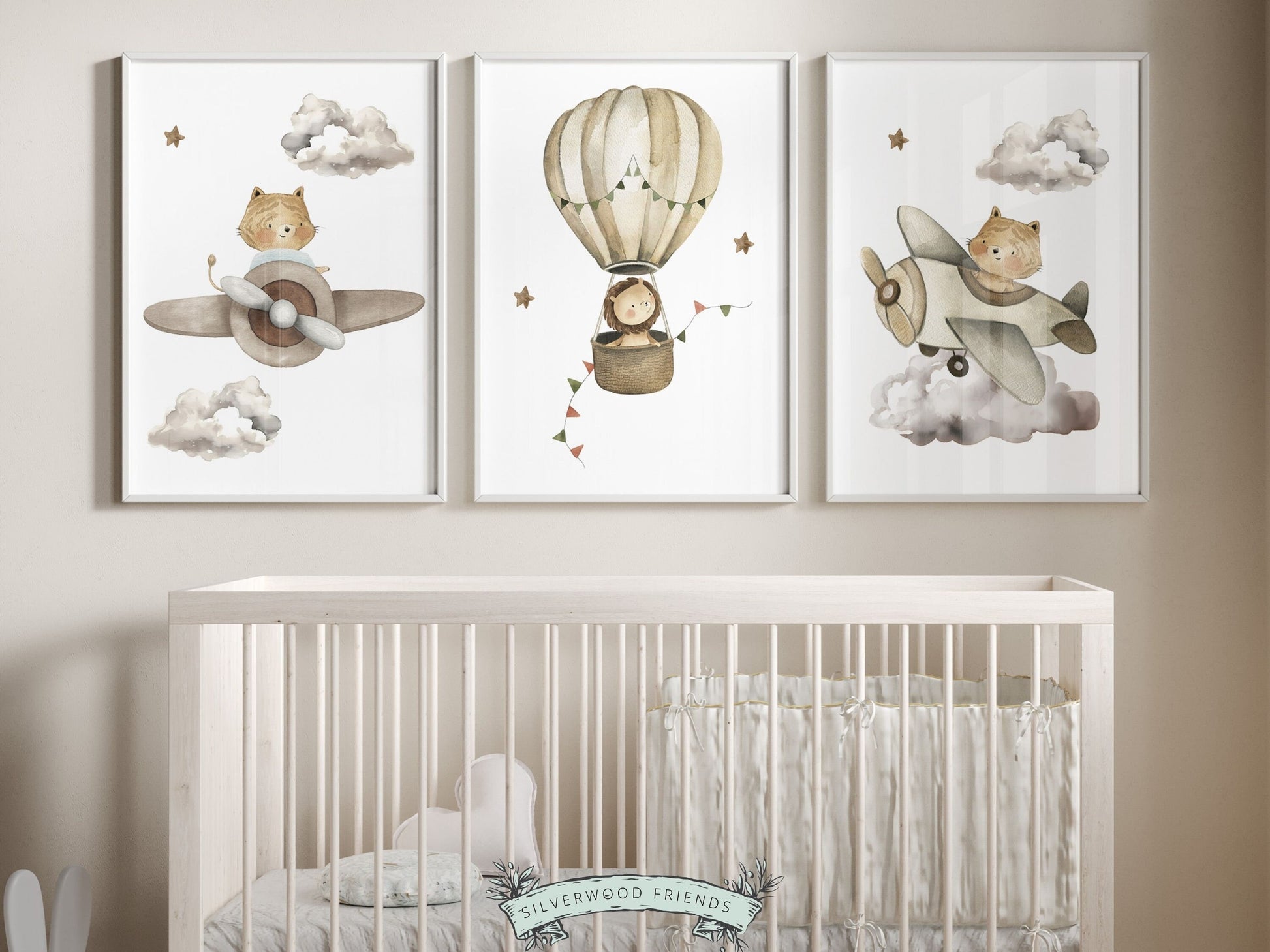 Hot Air Balloon Nursery Prints featuring watercolor safari animals in a hot air balloon and airplanes in a calming neutral color palette. Perfect for your safari nursery decor and also makes a unique gender neutral baby shower gift.