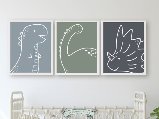 Transform your little ones space into a prehistoric paradise with our Set of 3 Dinosaur Nursery Prints, showcasing the majestic outlines of T-Rex, Brachiosaurus, and Triceratops against soothing blue and green backgrounds.
