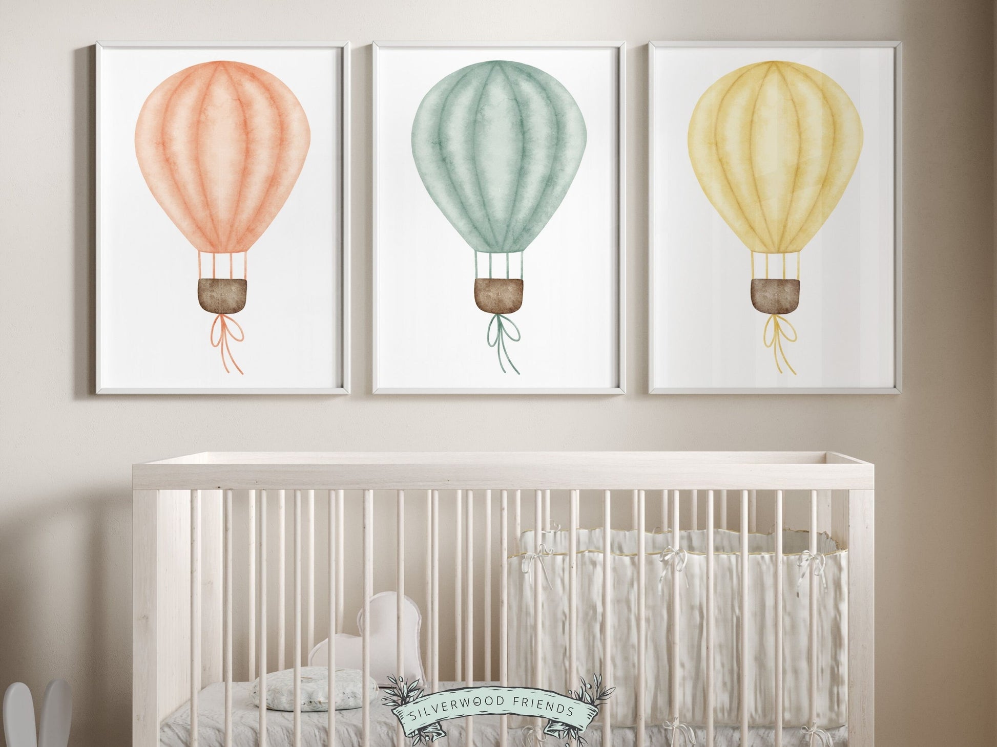 Set of 3 Hot Air Balloon Nursery Prints. Featuring charming watercolor balloons in blue, pink, and yellow, this delightful artwork creates a calm and cozy atmosphere, making it an ideal addition to your little ones space or as a baby shower gift.