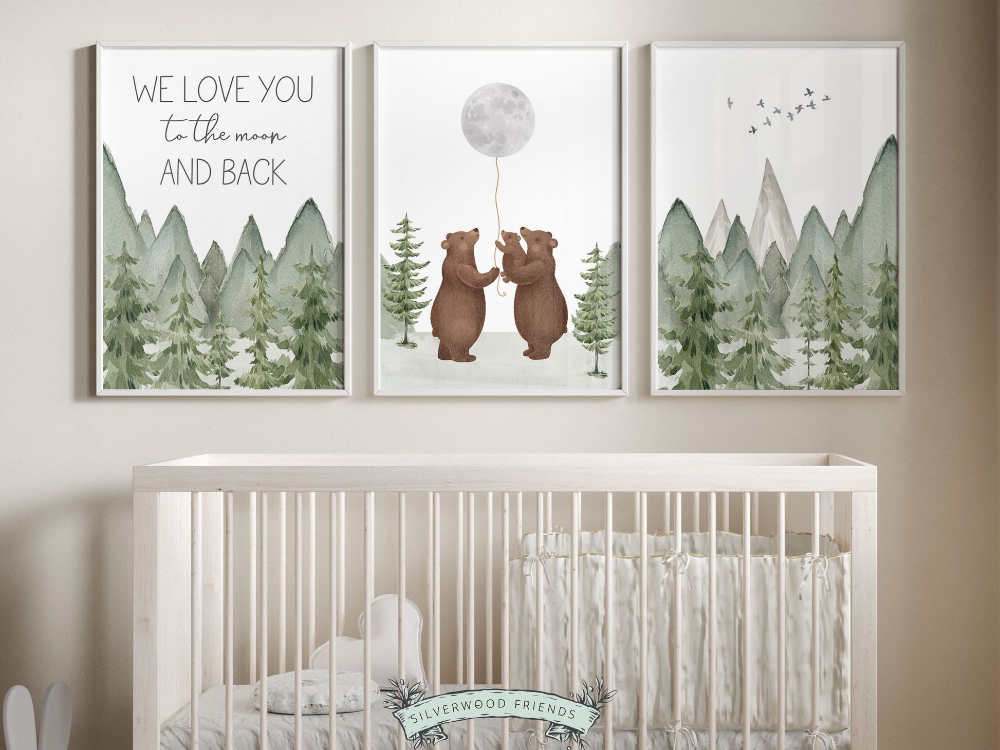 Set of 3 Bear Nursery Prints featuring a family of bears holding the moon and quote We love you to the moon and back and set against a mountain and woodland forest landscape. Ideal for your woodland nursery and makes an adorable baby shower gift.